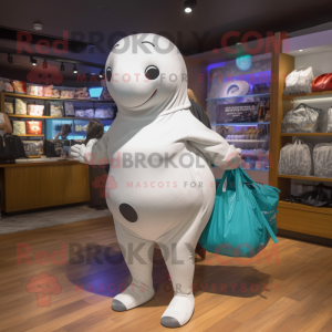 Silver Beluga Whale mascot costume character dressed with a Bikini and Tote bags