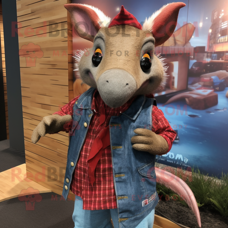 Red Armadillo mascot costume character dressed with a Denim Shirt and Shawl pins