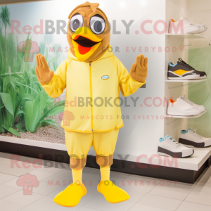 Tan Canary mascot costume character dressed with a Swimwear and Foot pads