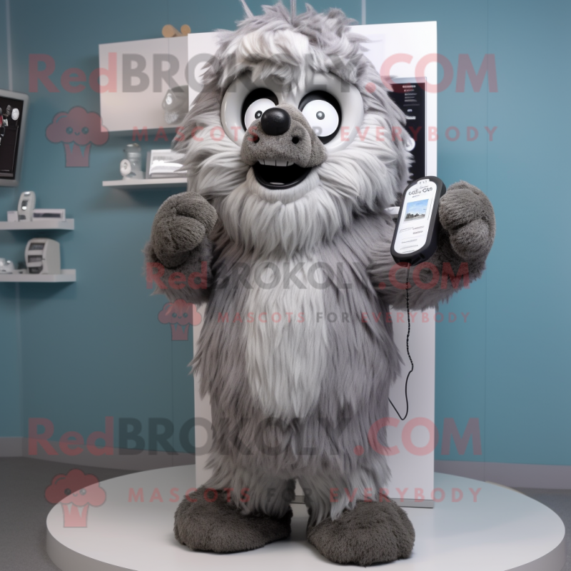 Gray Phone mascot costume character dressed with a Parka and Scarves Gray Phone mascot costume character dressed with a Parka and Scarves