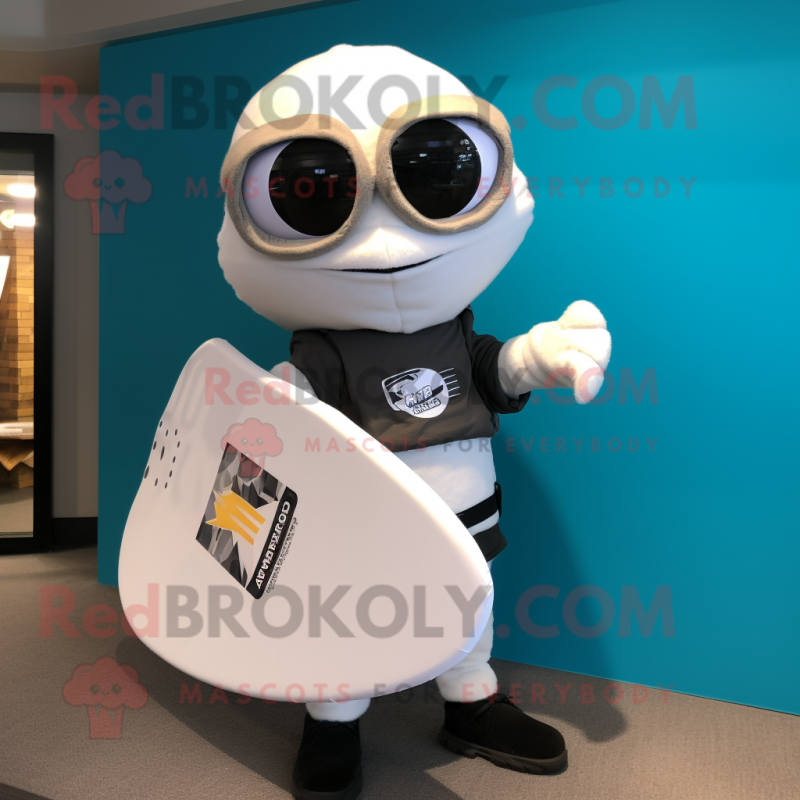 White Surfboard mascot costume character dressed with a Moto Jacket and Messenger bags