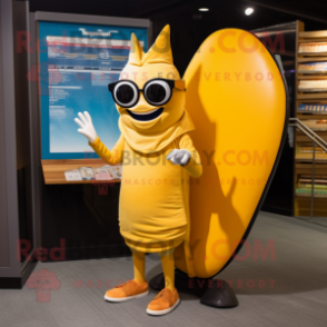 Gold Surfboard mascot costume character dressed with a Cover-up and Reading glasses