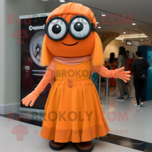 Orange Cyclops mascot costume character dressed with a Maxi Skirt and Berets