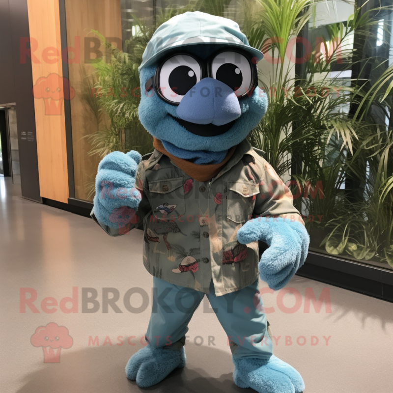 Teal Commando mascot costume character dressed with a Chambray Shirt and Scarves