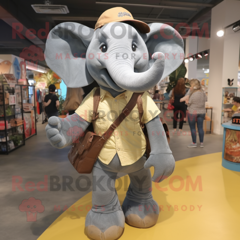 Gray Elephant mascot costume character dressed with a Mom Jeans and Messenger bags Gray Elephant mascot costume character dressed with a Mom Jeans and Messenger bags