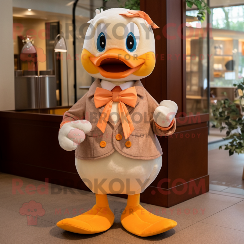 Peach Gosling mascot costume character dressed with a Long Sleeve Tee and Bow ties Peach Gosling mascot costume character dressed with a Long Sleeve Tee and Bow ties