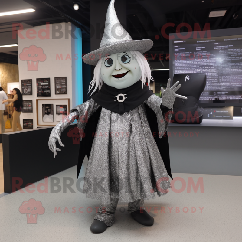 Silver Witch mascot costume character dressed with a Mini Skirt and Hat pins Silver Witch mascot costume character dressed with a Mini Skirt and Hat pins