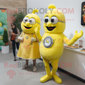 Lemon Yellow Paella mascot costume character dressed with a Shift Dress and Smartwatches