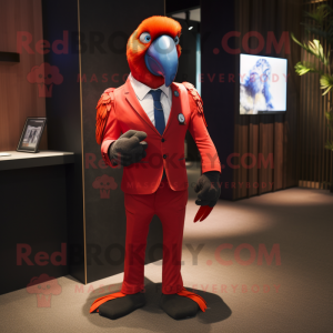 Red Macaw mascot costume character dressed with a Suit Jacket and Smartwatches