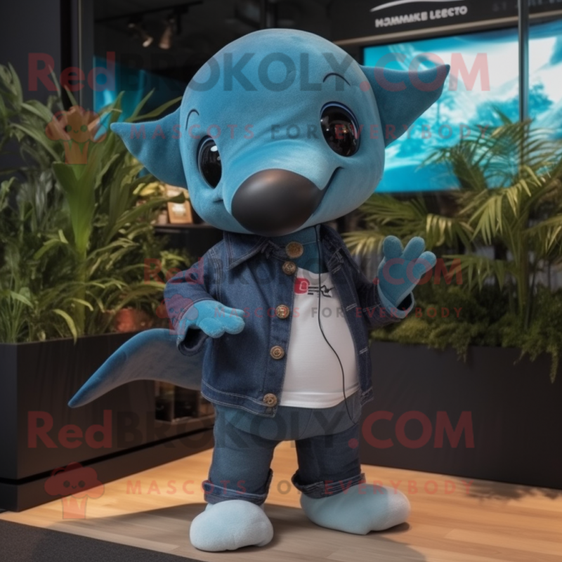 Turquoise Killer Whale mascot costume character dressed with a Denim Shorts and Ties