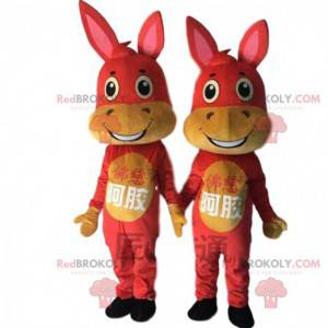 2 mascots of red and yellow donkeys, donkey costumes -