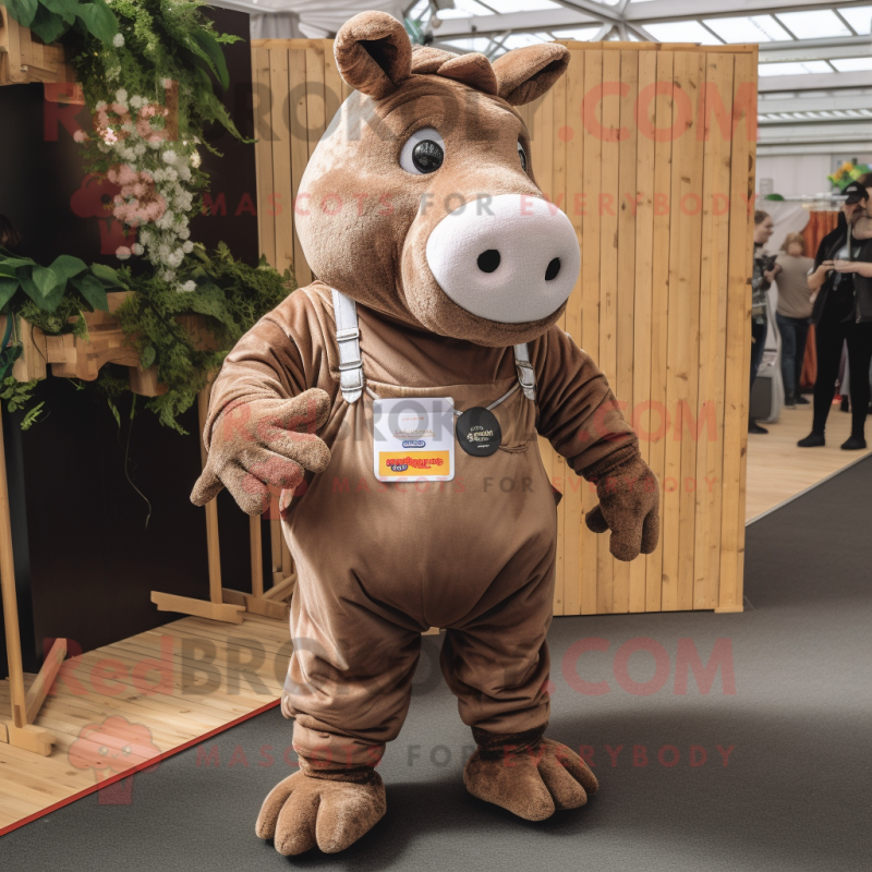 Brown Rhinoceros mascot costume character dressed with a Dungarees and Lapel pins