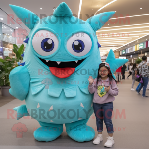 Turquoise Tuna mascot costume character dressed with a Mom Jeans and Wraps