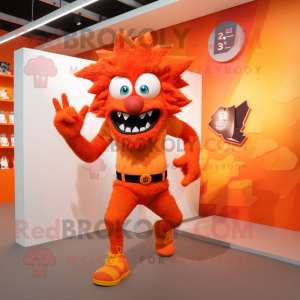 Orange Demon mascot costume character dressed with a Running Shorts and Hair clips