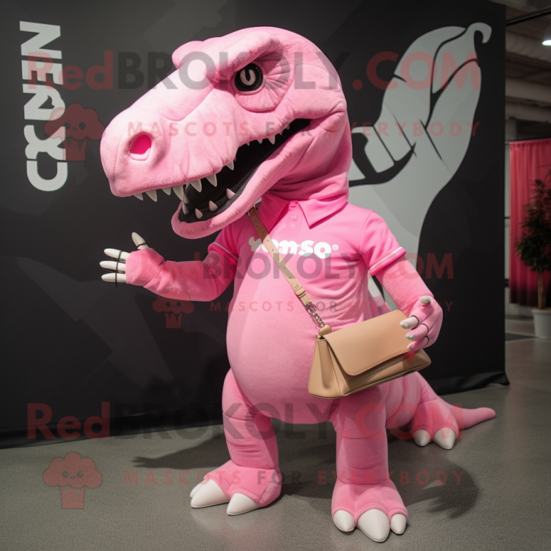 Pink Tyrannosaurus mascot costume character dressed with a Graphic Tee and Messenger bags