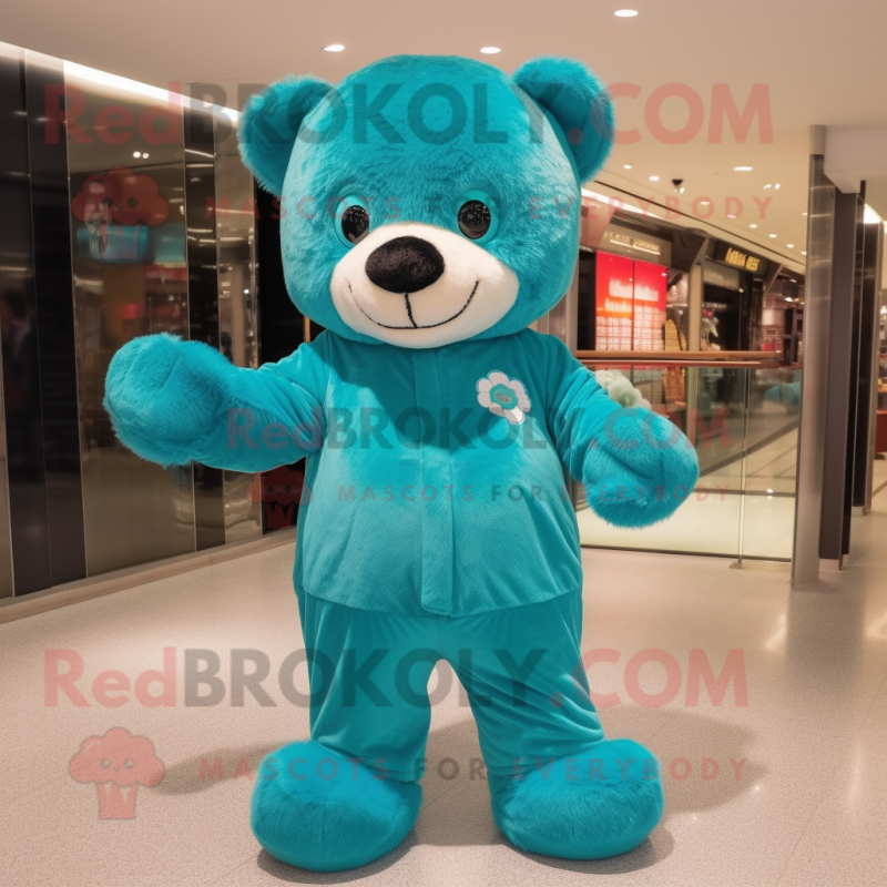 Teal Teddy Bear mascot costume character dressed with a Jumpsuit and Shoe clips Teal Teddy Bear mascot costume character dressed with a Jumpsuit and Shoe clips