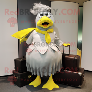 Silver Canary mascot costume character dressed with a Maxi Skirt and Briefcases