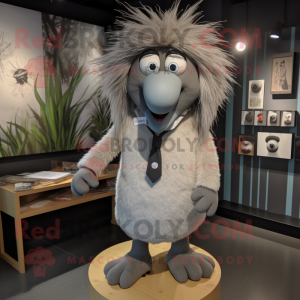 Gray Kiwi mascot costume character dressed with a Dress Shirt and Hairpins