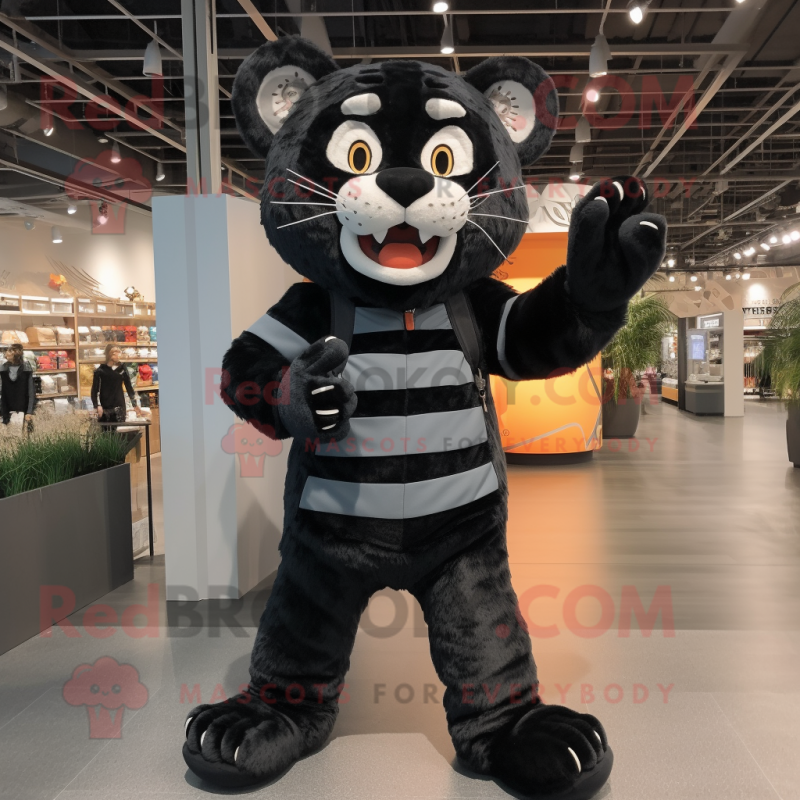 Black Tiger mascot costume character dressed with a Overalls and Shoe laces Black Tiger mascot costume character dressed with a Overalls and Shoe laces