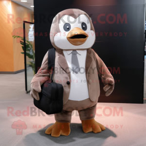 Brown Penguin mascot costume character dressed with a Suit Pants and Backpacks