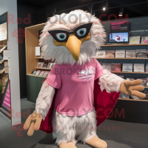 Pink Haast'S Eagle mascot costume character dressed with a Graphic Tee and Reading glasses