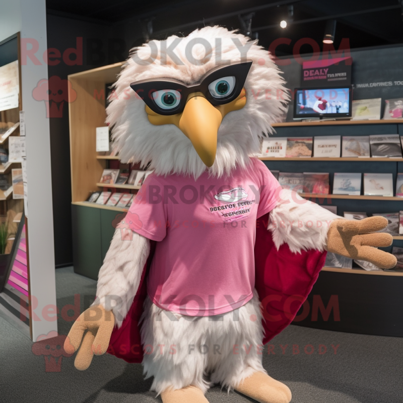 Pink Haast'S Eagle mascot costume character dressed with a Graphic Tee and Reading glasses