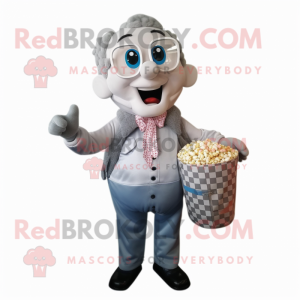 Silver Pop Corn mascot costume character dressed with a Button-Up Shirt and Tote bags