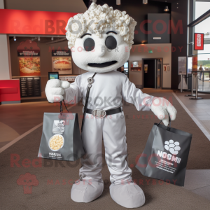 Silver Pop Corn mascot costume character dressed with a Button-Up Shirt and Tote bags
