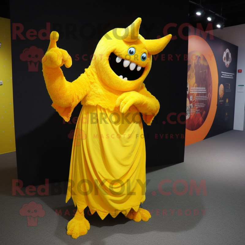 Yellow Demon mascot costume character dressed with a Evening Gown and Shawl pins Yellow Demon mascot costume character dressed with a Evening Gown and Shawl pins
