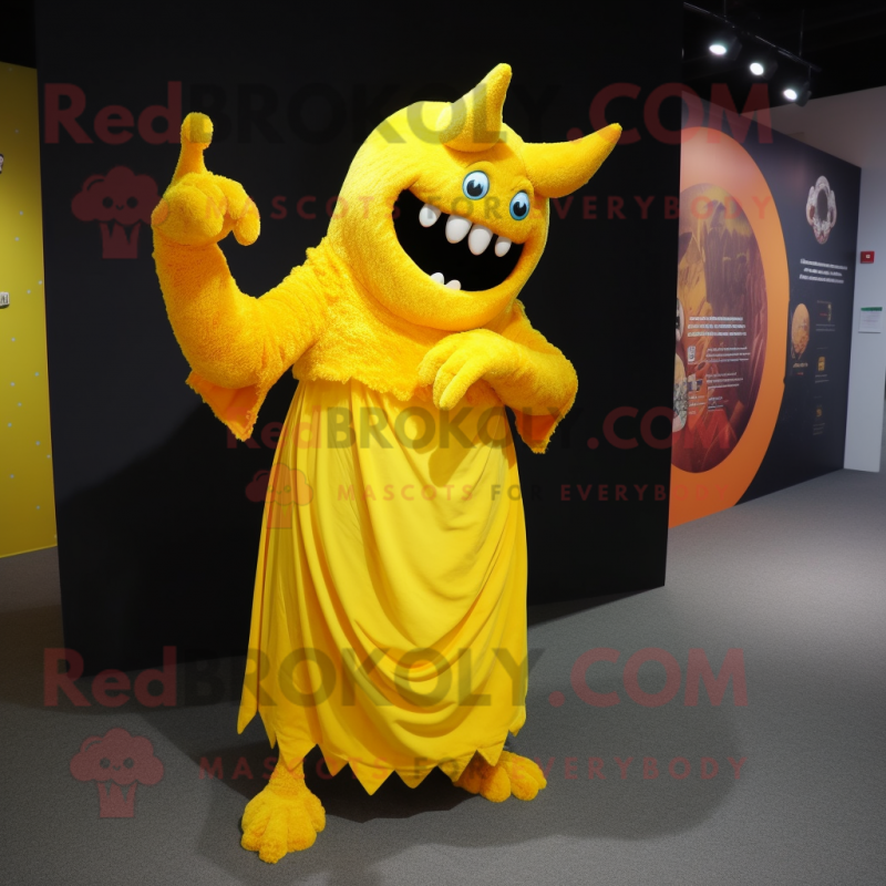 Yellow Demon mascot costume character dressed with a Evening Gown and Shawl pins