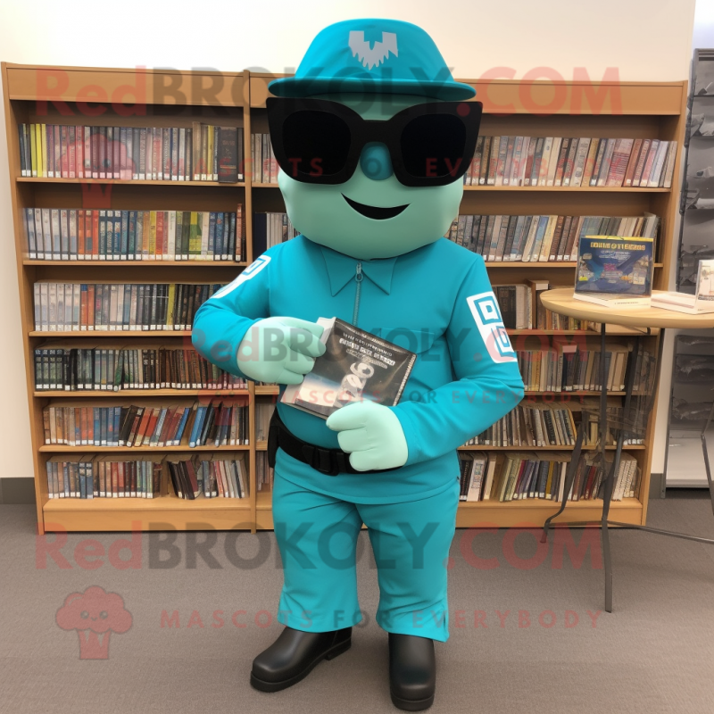 Turquoise Commando mascot costume character dressed with a Shift Dress and Reading glasses Turquoise Commando mascot costume character dressed with a Shift Dress and Reading glasses