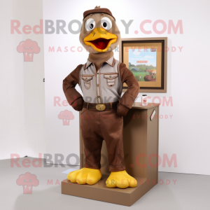 Brown Dove mascot costume character dressed with a Bootcut Jeans and Brooches