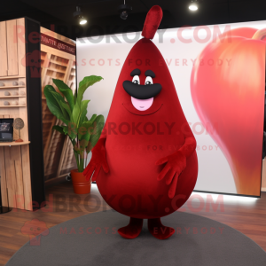 Red Pear mascot costume character dressed with a Suit and Shawls