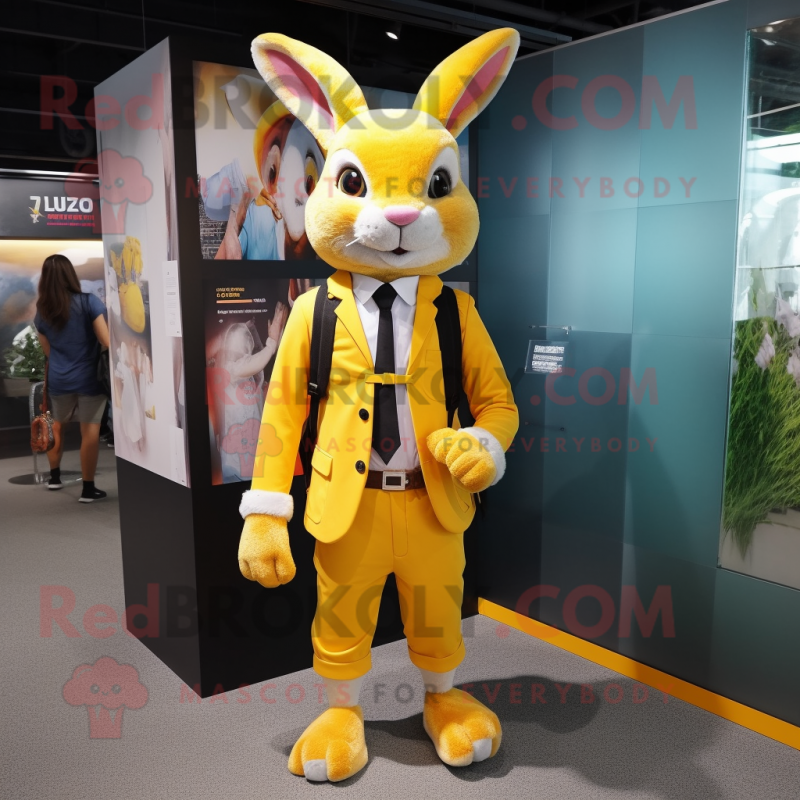 Yellow Wild Rabbit mascot costume character dressed with a Blazer and Backpacks