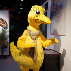 Yellow Dodo Bird mascot costume character dressed with a Waistcoat and Shawl pins