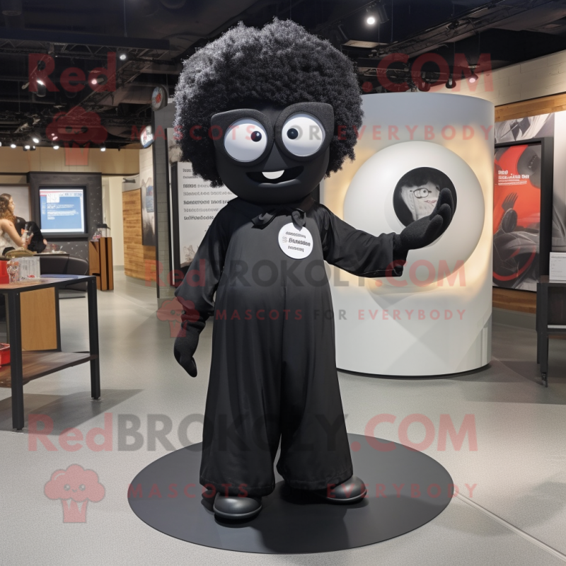 Black Plate Spinner mascot costume character dressed with a Jumpsuit and Eyeglasses