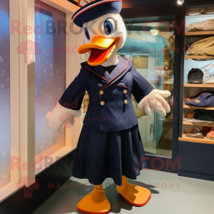 Navy Muscovy Duck mascot costume character dressed with a Dress Shirt and Mittens