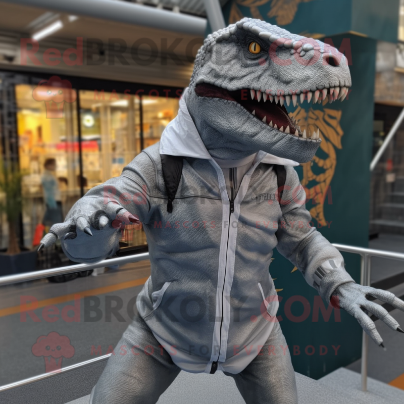 Silver Allosaurus mascot costume character dressed with a Parka and Headbands