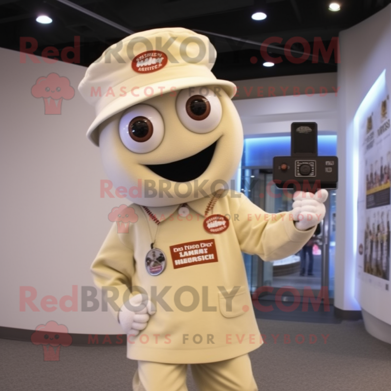 Cream Camera mascot costume character dressed with a Button-Up Shirt and Caps Cream Camera mascot costume character dressed with a Button-Up Shirt and Caps