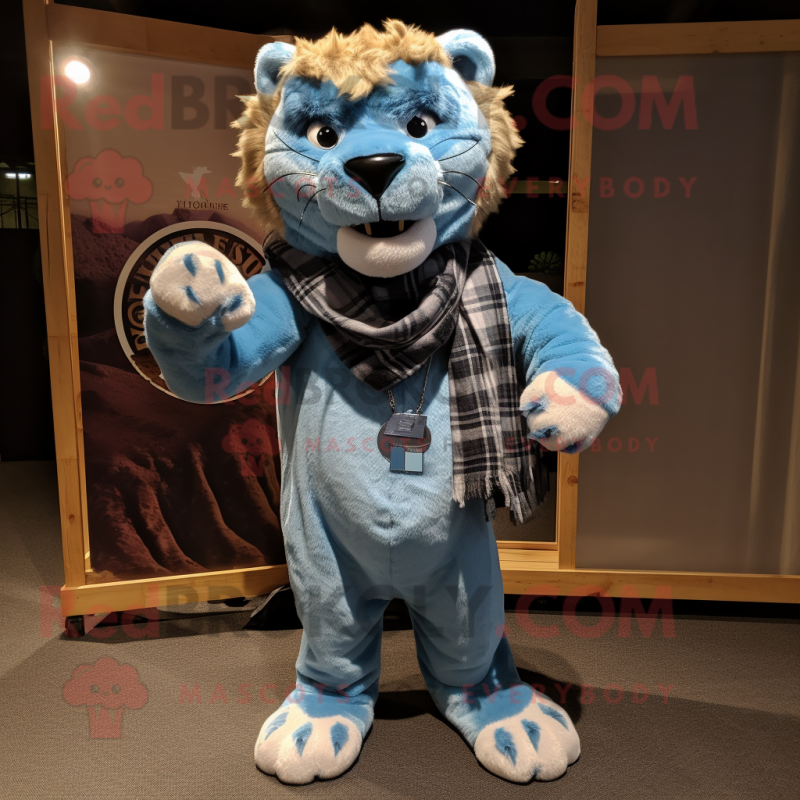 Sky Blue Smilodon mascot costume character dressed with a Flannel Shirt and Shawl pins