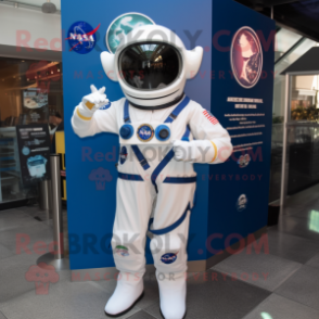 Navy Astronaut mascot costume character dressed with a Graphic Tee and Lapel pins