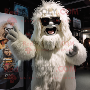 Cream Yeti mascot costume character dressed with a T-Shirt and Eyeglasses