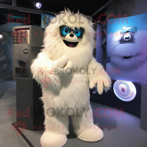 Cream Yeti mascot costume character dressed with a T-Shirt and Eyeglasses