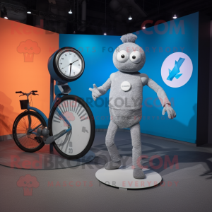 Gray Unicyclist mascot costume character dressed with a Mini Dress and Smartwatches