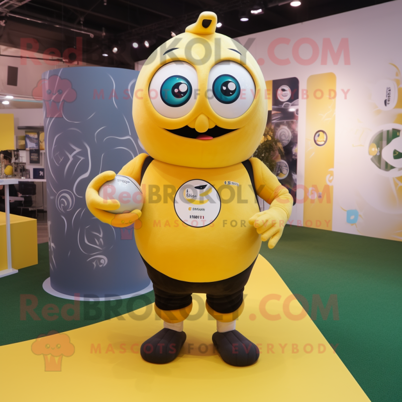 Yellow Rugby Ball mascot costume character dressed with a T-Shirt and Rings Yellow Rugby Ball mascot costume character dressed with a T-Shirt and Rings