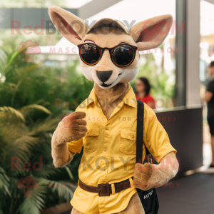 Gold Kangaroo mascot costume character dressed with a Chinos and Eyeglasses