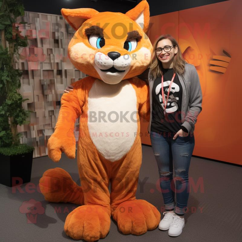 Orange Lynx mascot costume character dressed with a Boyfriend Jeans and Shawl pins