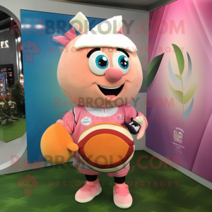 Peach Pink mascot costume character dressed with a Rugby Shirt and Shawls