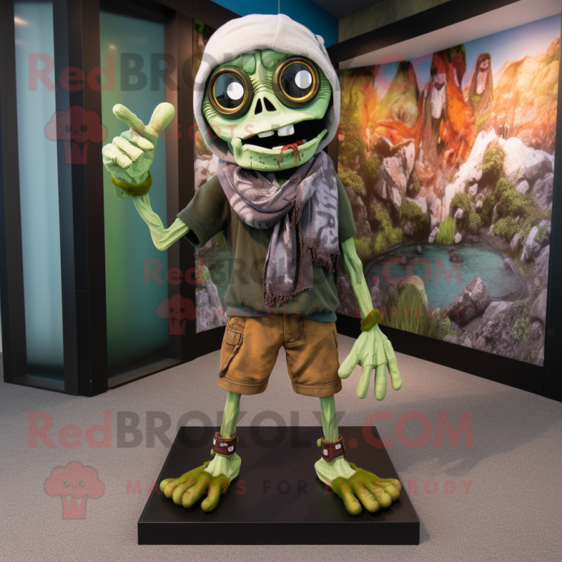 Olive Undead mascot costume character dressed with a Bermuda Shorts and Scarves Olive Undead mascot costume character dressed with a Bermuda Shorts and Scarves