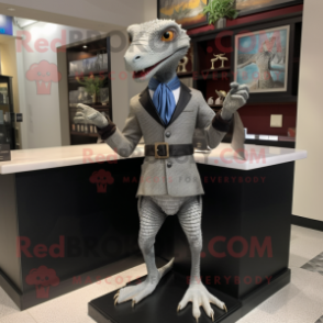 Gray Lizard mascot costume character dressed with a Sheath Dress and Lapel pins